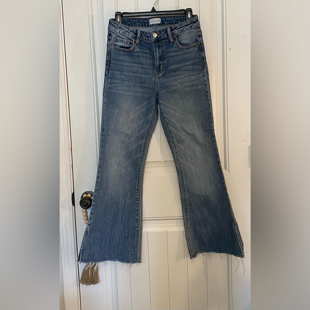 Womens high-rise, cropped flare jeans with frayed hems and side slits size 3